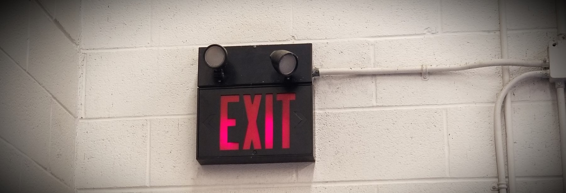 Exit sign inside a building on a wall