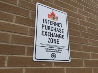 Sign showing Internet Purchase Exchange Zone
