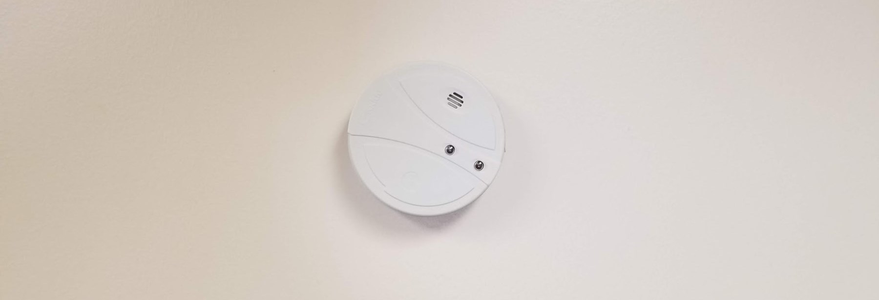 smoke alarm on a ceiling